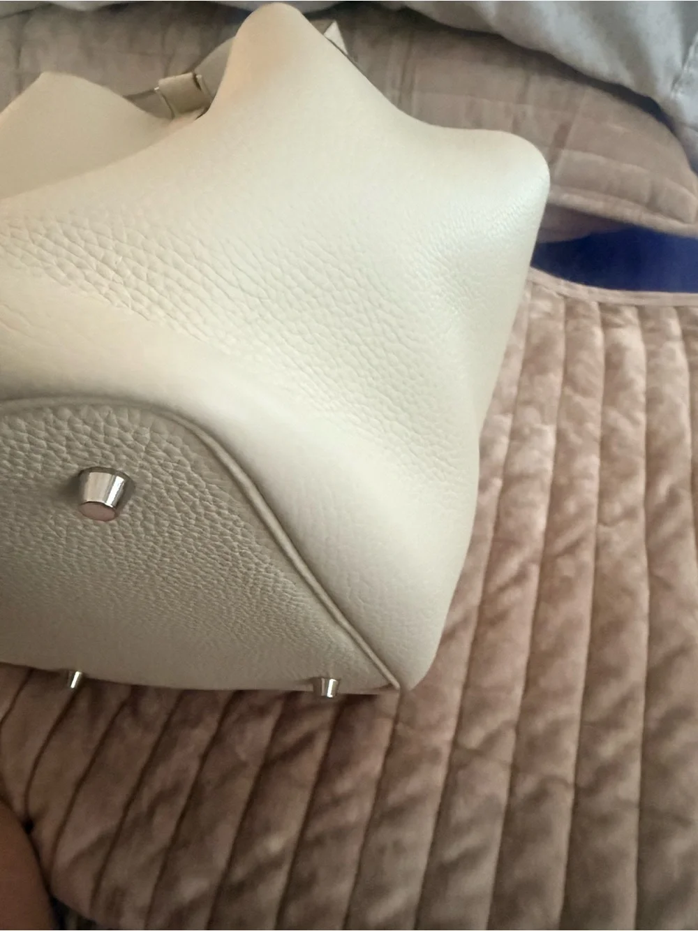 Leather bucket bag with charm